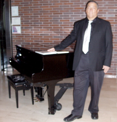 Teo Vincent IV at RCM Royal Conservatory Of Music Lobby Grand Piano showing his Music Books, white music tie. Tthough less sharp focus but for you to see the books is the most important thing! I'm academic, not nuts!
